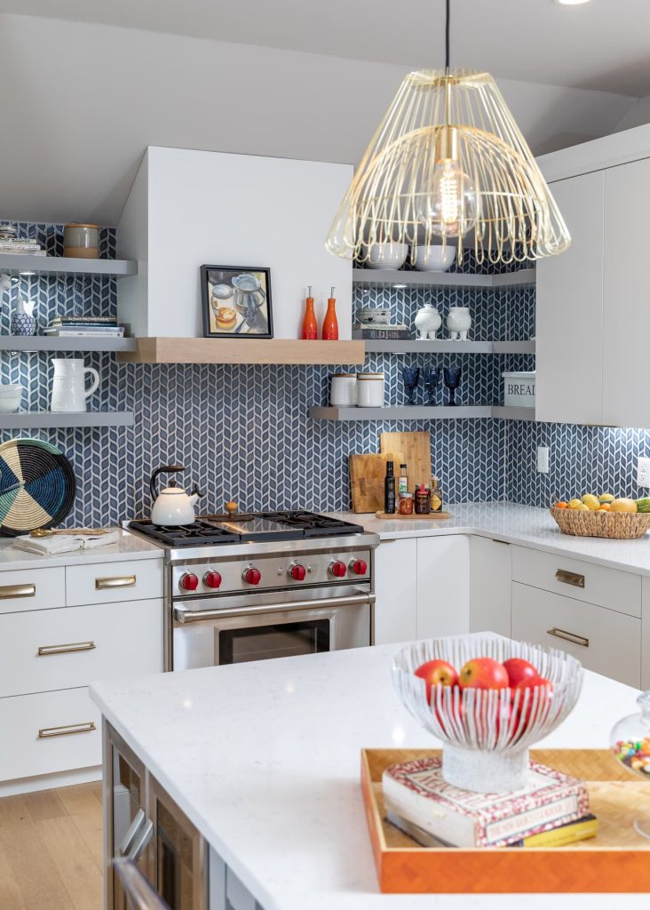 Blue tile back splash in a white and blue kitchen remodel